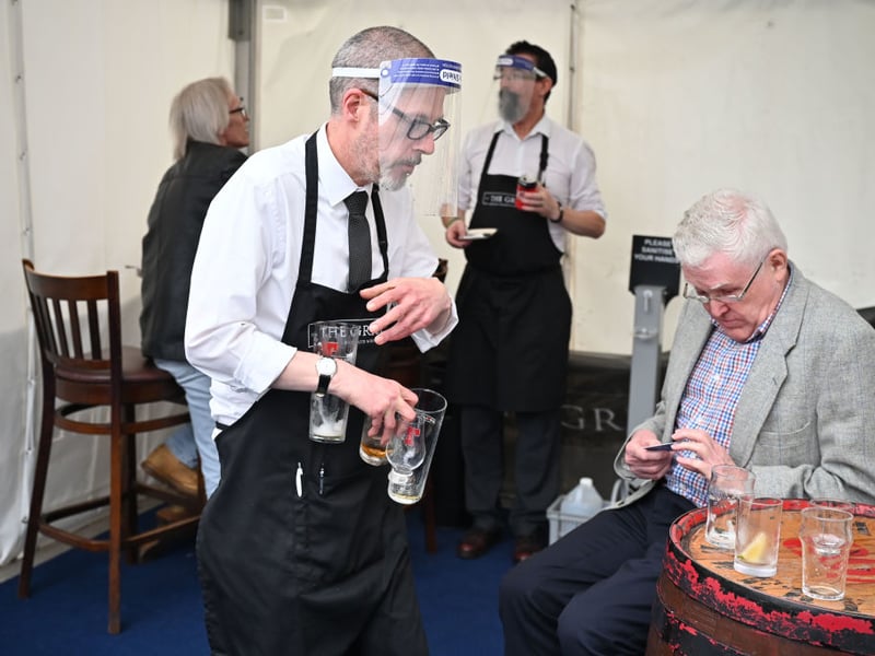 Kieth McKenzie wears a shielding face mask as he prepares to close The Grill pub on Aberdeen's Union Street on August 5, 2020. Nicola Sturgeon had just announced Aberdeen would be put back into lockdown after cases of Coronavirus soared.