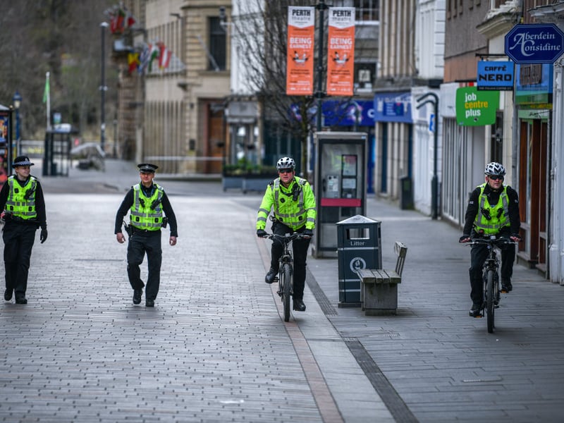 Police patrol an emptry Perth High Street during the lockdown in April 2020.