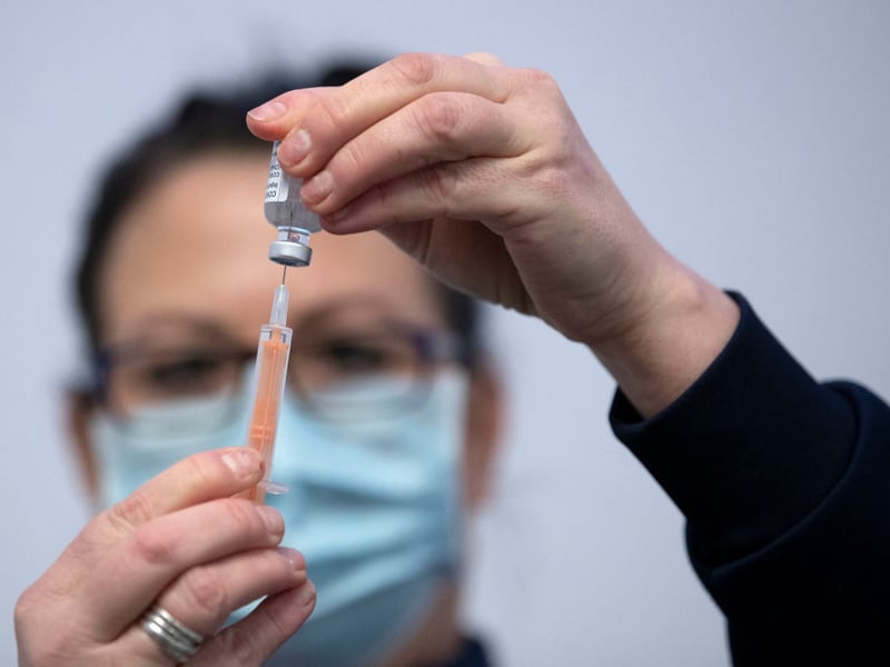 Nurse Sarah MacLeod, from the Vaccination Team, prepares a syringe with a dose of a Covid-19 vaccine, at an NHS Scotland vaccination centre set up at the Edinburgh International Conference Centre (EICC).