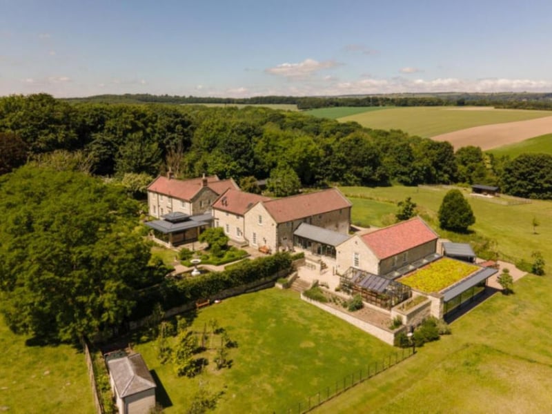This modern country house in Gilling East, near York, has six bedrooms, six bathrooms and four reception rooms, and boasts outstanding views of the rolling hills surrounding it. It includes a leisure suite with swimming pool and gym, a games room, a cinema room with bar, and an air-conditioned wine store.