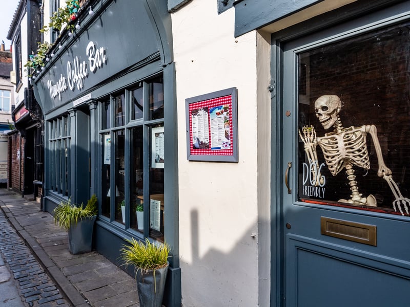 A skeleton waves from the door of Newgate Coffes Bar, in York, during the first Covid lockdown in April 2020