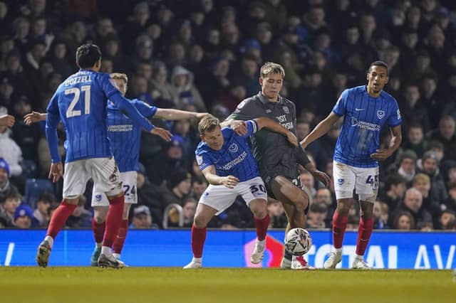 Pompey players press Cardiff's Ruben Colwill last month - but just how 'relentless' in their work compared to Championship rivals?