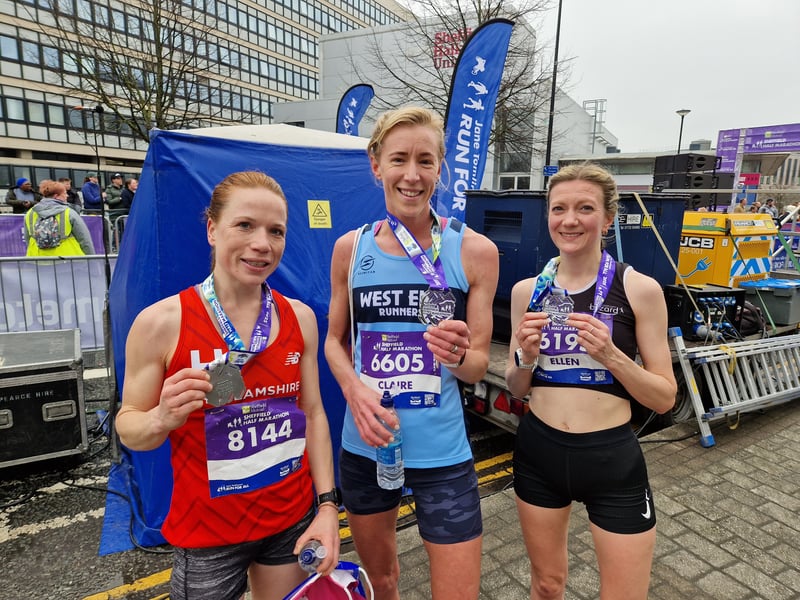 Three runners with their medals after the race. Photo: David Kessen, National World