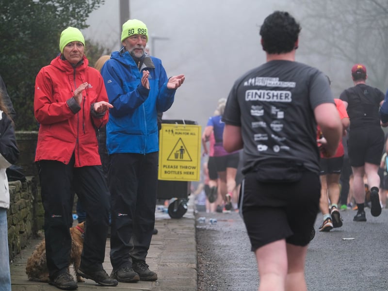 Spectators applaud the runners at Ringinglow. Photo: Dean Atkins, National World