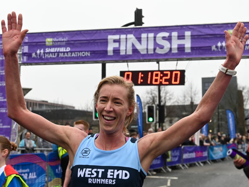 A runner celebrates at the end of the race. Photo: Charley Atkins, Natinonal World
