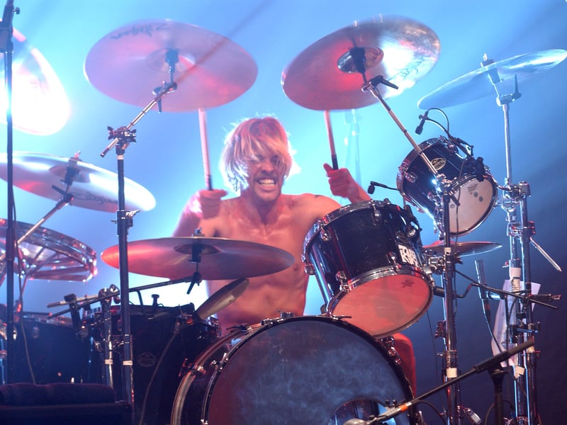 Drummer Taylor Hawkins of the band Foo Fighters performs at the Wiltern Theatre on October 22, 2002 in Los Angeles, California.