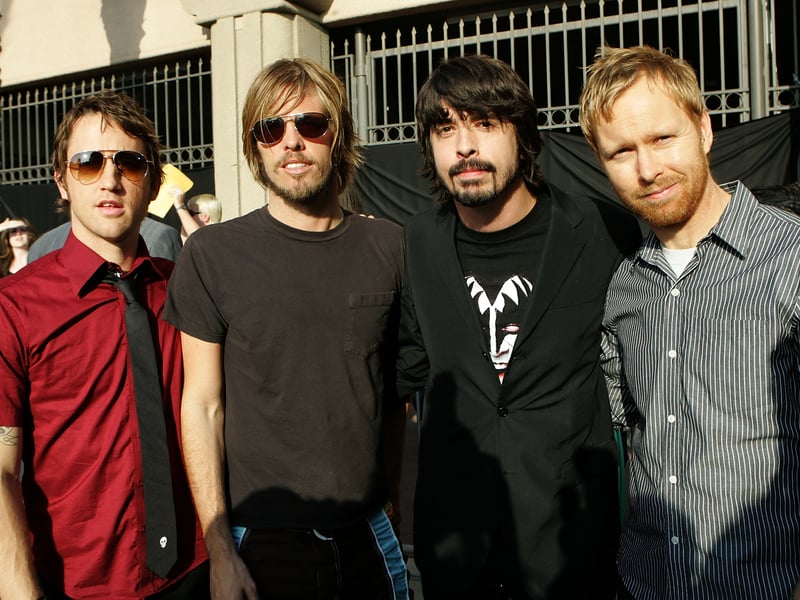 L to R) Musicians Nate Mendel, Taylor Hawkins, Dave Grohl and Chris Shiflett of The Foo Fighters arrive to the 2005 MTV Movie Awards at the Shrine Auditorium June 4, 2005 in Los Angeles, California.