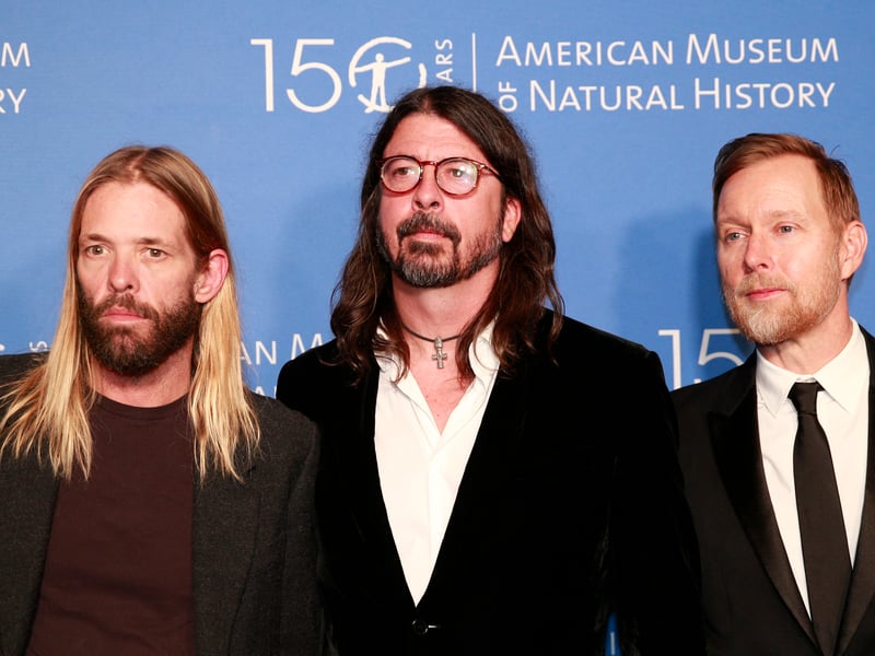Taylor Hawkins, Dave Grohl and Nate Mendel of US rock band the Foo Fighters attend the The Museum Gala at the American Museum of Natural History on November 18, 2021 in New York City. 