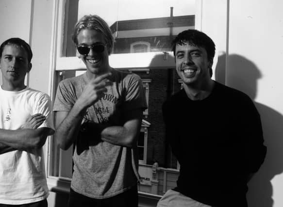 Foo Fighters group portrait, London, 1997. L to R: Chris Shiflett, Taylor Hawkins, Dave Grohl.