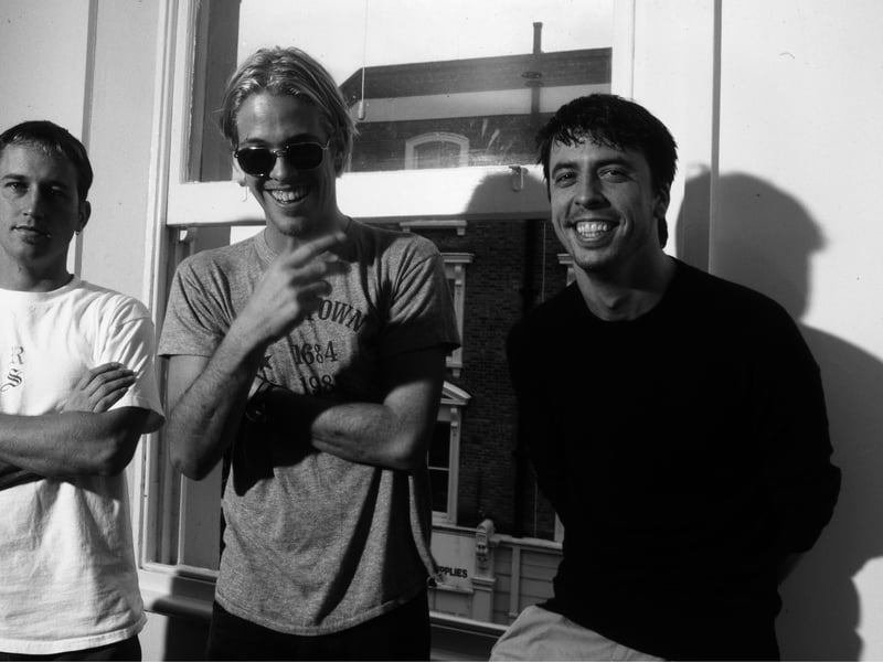 Foo Fighters group portrait, London, 1997. L to R: Chris Shiflett, Taylor Hawkins, Dave Grohl.