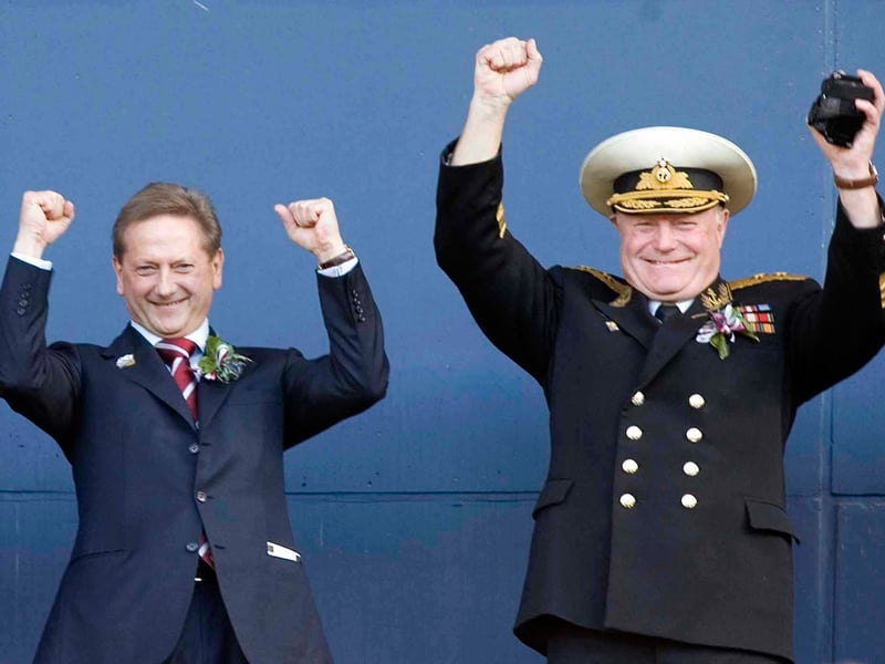 Romanov celebrates his side's Tennent's Scottish Cup win with one of his guests, a former Cold War Soviet Submariner.