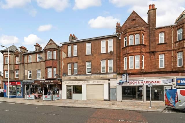 This traditional one-bedroom second floor flat on West Princes Street in Helensburgh has been reduced by £15,000 since it was first listed. It has been 'extensively upgraded', with a refitted breakfasting kitchen, and is described as an 'ideal' first time buy.