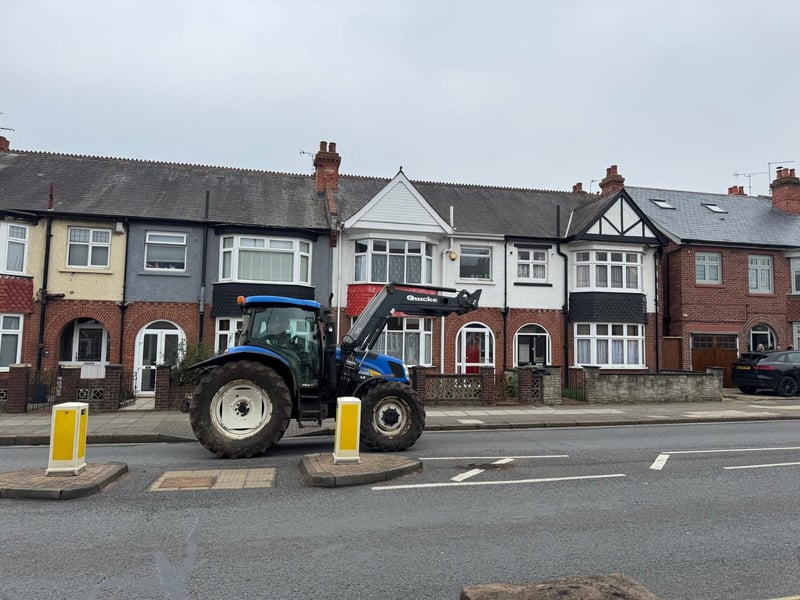 The tractors make their way down Northern Parade as they head to the Guildhall to protest.