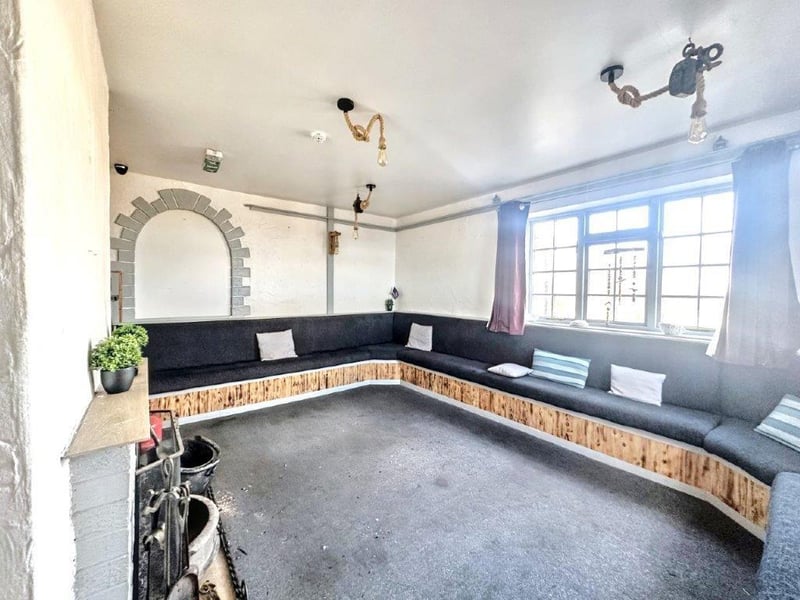 A snug area with fireplace in the pub