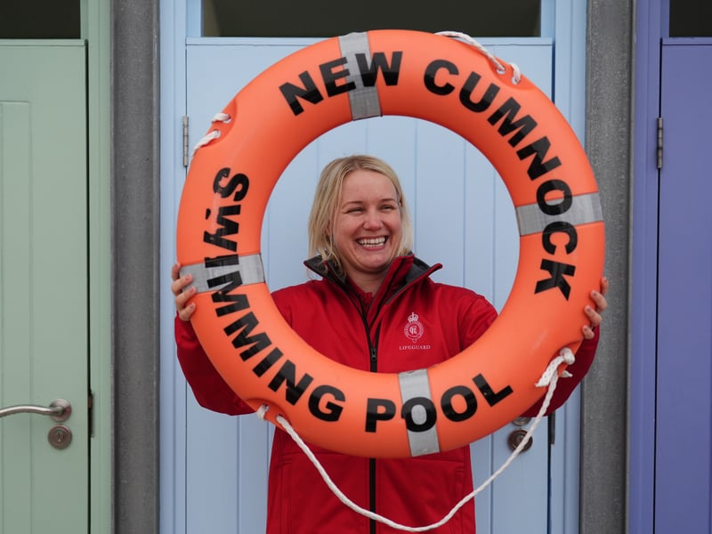 Lifeguard Lauren Holden holds a lifebuoy ring