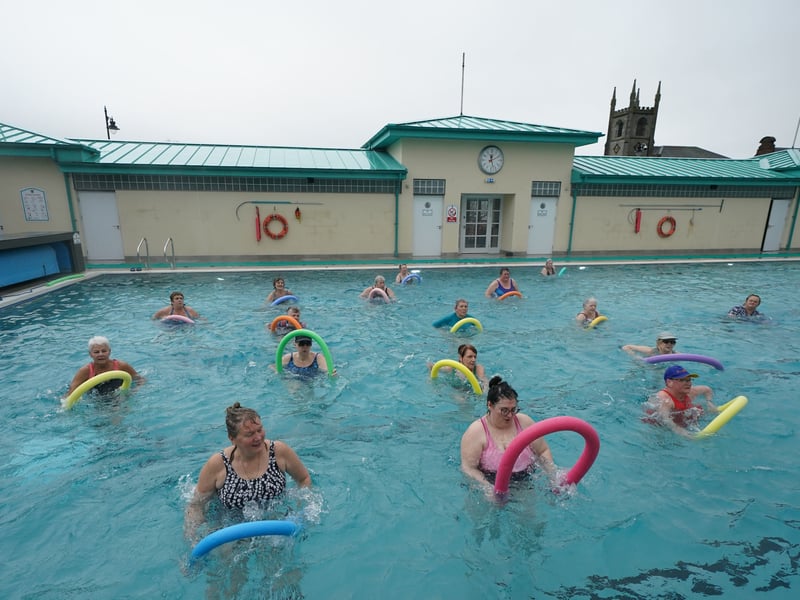 Swimmers braving the Spring air today - and having a laugh doing it.