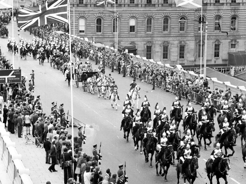 Queen Elizabeth II and King Carl Gustav of Sweden in a procession up North Bridge during his state visit to Britain in July 1975.