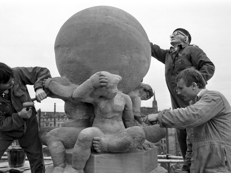 Workmen cleaning up some of the stone carvings on the Scotsman Publications building at North Bridge in December 1978.