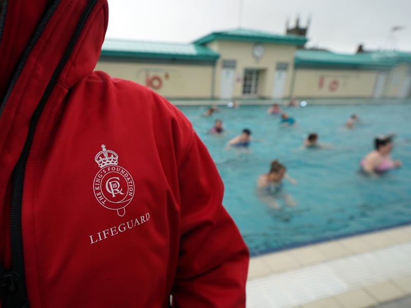 The Kings Foundation logo is visible on a lifeguards jacket