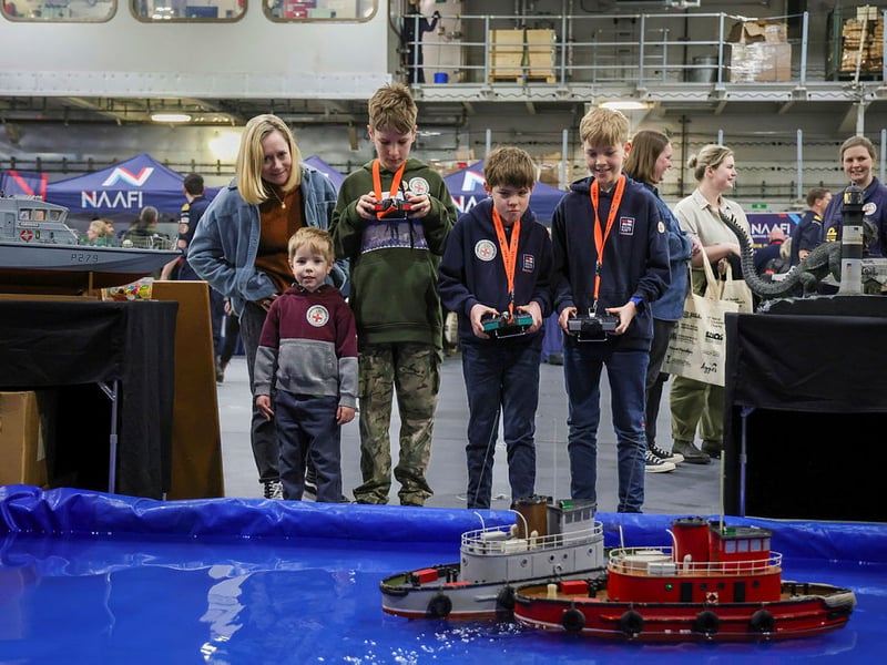 HMS Prince of Wales welcoming families and affiliates on board ahead of Indo-Pacific deployment. Pictured: Family of Lieutenant Commander Scott.
