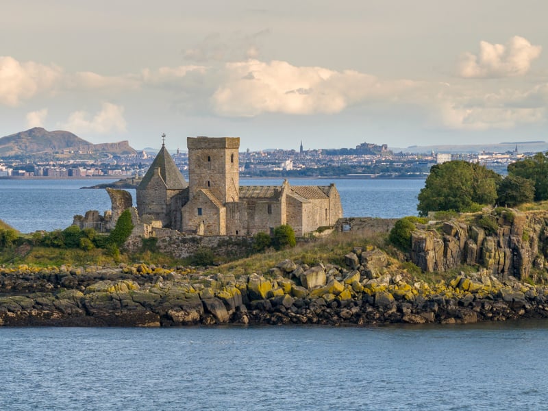 Home to the best-preserved group of monastic buildings in Scotland, the abbey on the island in the Forth was originally a priory founded by David I.
It's location has made the island a sanctuary - first for religious followers and then for wildlife - as well as a place of strategic importance. Coastal defences were placed here during World War Two to protect Rosyth naval base, the Forth Bridge and Edinburgh.
Tickets for a trip can be bought from the Maid of the Forth or Forth Boat Tours.
Once you step on the island, highlights include the rare medieval fresco, which dates from the 13th Century.