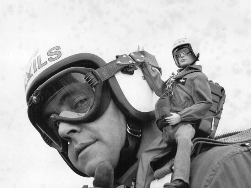 The Action Man toy figure was launched in 1966 as the UK's answer to GI Joe, and was an instant hit. An Action Man toy is pictured here on the shoulder of a member of the Red Devils parachute display team in 1968.