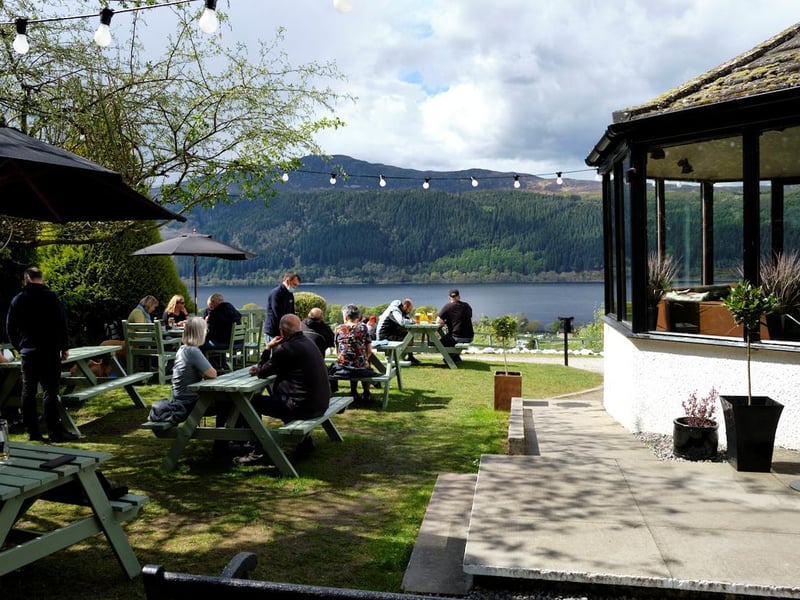 The ground floor features a reception area, a snug lounge area, bar and restaurant, and a garden area with picnic benches.