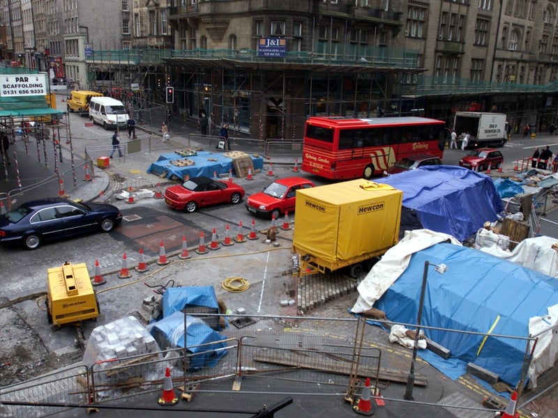 Road maintenance disrupts traffic at the junction of North Bridge and the High Street in May 2001. The works were to replace tarmac with traditional setts.