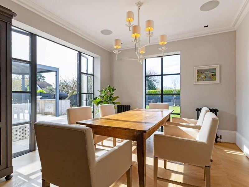The listing says: "As you enter the property from a stunning tessellated tilled path under a veranda on the western side of the property, you are welcomed into the hall with access to a useful study with a fireplace and a bay window overlooking the garden."