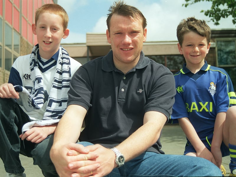 Simon Davey from Preston North End  with Phillip Turnball, 12, and Jonathan Slatre, 7, at Tulketh High school's football frenzie