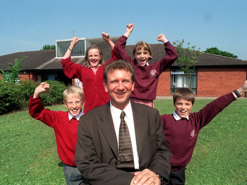 Broad Oak CP School headteacher Ian Kirkland and year 6 pupils, from left, Tom Pattinson, 11, Abigail Dore, 11, Lucy Meadows, 11 and Rafael Gonzalez, 11, celebrate their school in Penwortham near Preston, being selected as a "Beacon School"