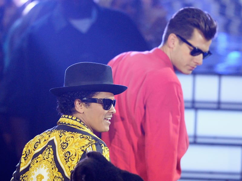 Uptown Funk, released in 2014, is a funk and soul-infused hit that became a global phenomenon, dominating charts and dance floors worldwide. Driven by Bruno Mars's charismatic performance and its stylish, retro aesthetic, the music video captures the energy and groove of the song, making it a party starter.