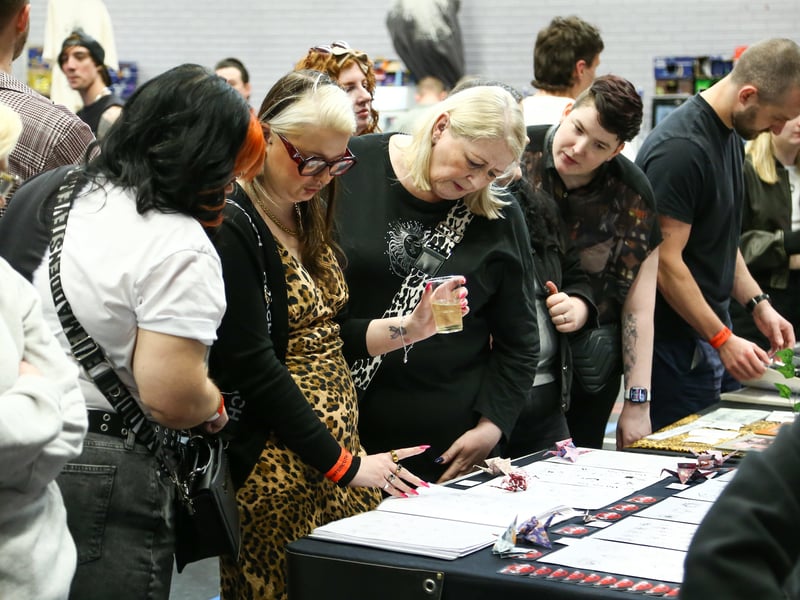 Looking at the tattoo artists' work. Picture Nathan Lipsham