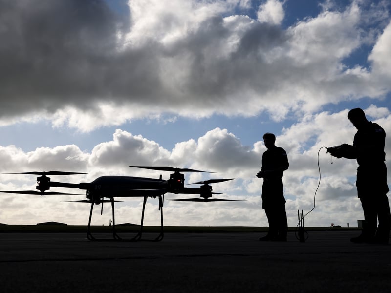 Pictured: (L/R) Able Rate Michael Page and Lieutenant Matthew Parfitt of 700X NAS, testing on one of the squadron's Malloy T-150 drones.