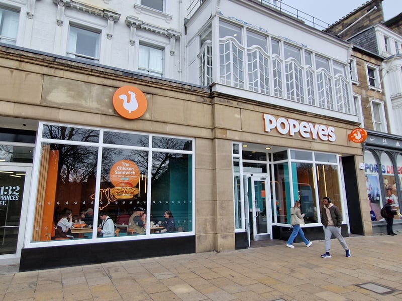 Popular fried chicken chain Popeyes has taken over the former Halifax branch at 131-133 Princes Street for its first Edinburgh restaurant, which opened in March 2025.
Founded in New Orleans in 1972, the fast food outlet sells a wide range of fried chicken dishes from burgers and wraps to chicken wings and chicken on the bone.
It already has restaurants in Glasgow and Aberdeen and over 4,000 around the world in more than 30 countries.