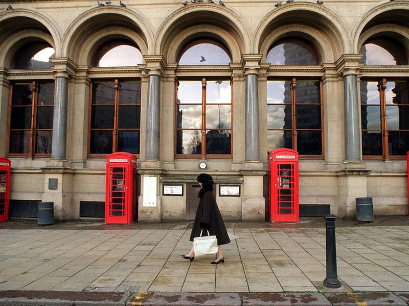 Traditional Red phone boxes stand proud in City Square outside the Leeds General Post Office. Pictured in December 1997.