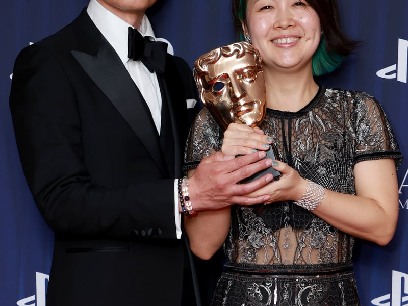 Azusa Kido (R) poses in the winners room with the Narrative Award on behalf of the Development Team for 'Metaphor: ReFantazio' during the BAFTA Games Awards 2025.