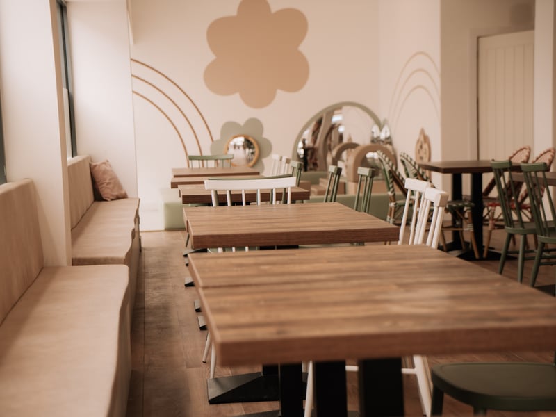The seating area for adults to relax and catch up with friends while having a clear view of children playing.