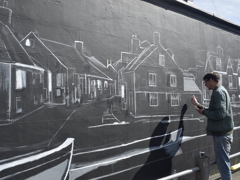 Roxie Tricker has opened up her own coffee shop called South Street Coffee Co in South Street, Emsworth. 

Pictured is: Mural artist Doug Cole painting a mural on the side of South Street Coffee Co.

Picture: Sarah Standing (090425-1642)
