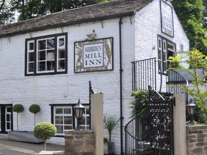 Shibden Mill Inn is a historical pub which is located in a scenic area of West Yorkshire. The pub takes its name from its origins as a corn and spinning mill, before transforming into an inn during the late 19th century. 