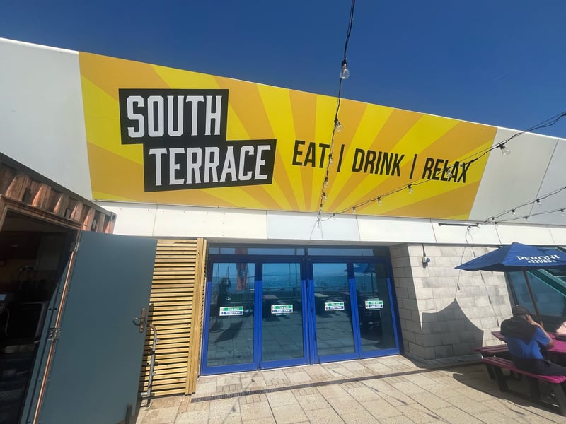 The outdoor pop-up cafe and bar is in a prime location overlooking the beach. 