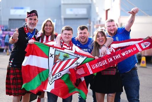 Rangers and Athletic Bilbao fans pose for photographs ahead of the game.