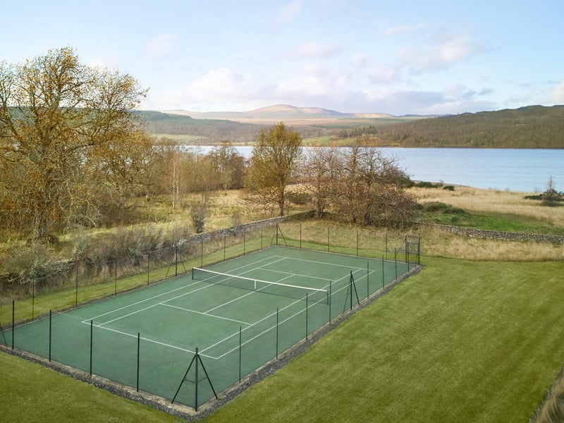 The four-bedroom property even features an outdoor tennis court.