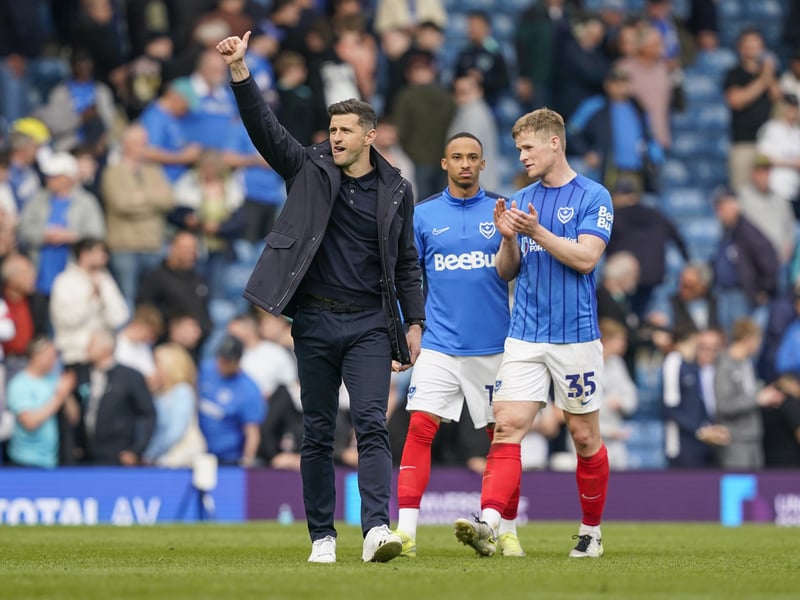 Pompey boss John Mousinho and Rob Atkinson acknowledge the crowd after the game.