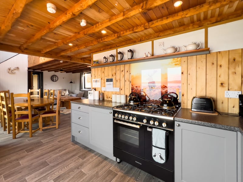 The off-grid property runs on its own renewable energy supply, with 28 solar panels shared with its neighbouring property Dun Ban.
A private water supply and oil -fired condensing boiler complete the services.