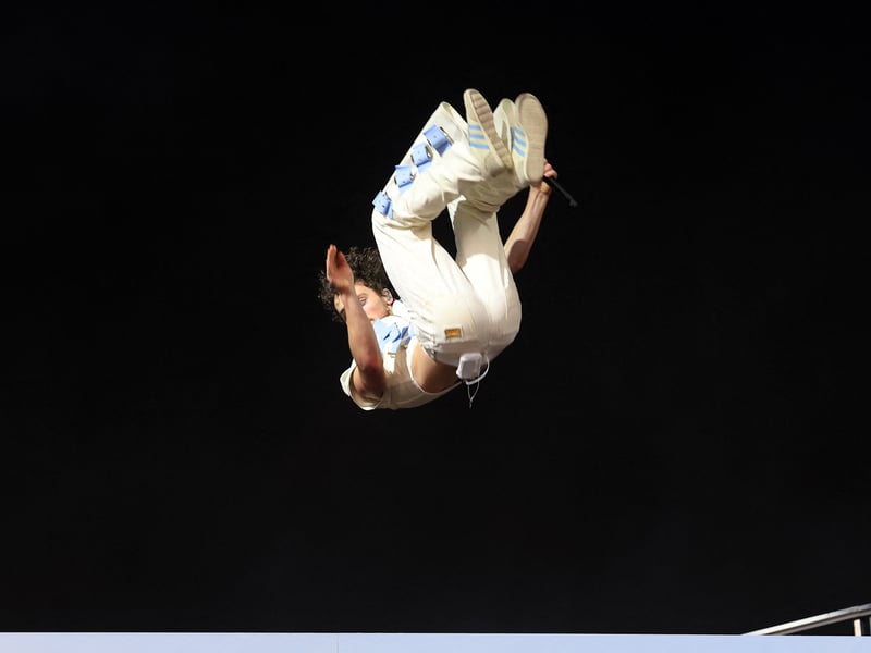 US singer songwriter Benson Boone does a flip as he performs during the 2025 Coachella Valley Music and Arts Festival at Empire Polo Club on April 11, 2025 in Indio, California.