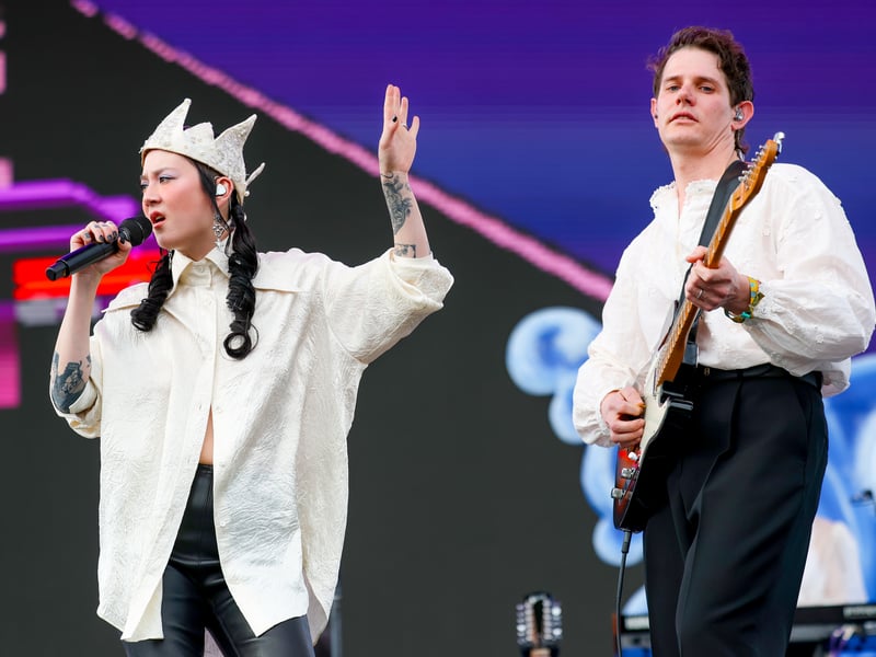 (L-R) Michelle Zauner and Peter Bradley of Japanese Breakfast perform at Outdoor Theatre during the 2025 Coachella Valley Music and Arts Festival at Empire Polo Club on April 12, 2025 in Indio, California.
