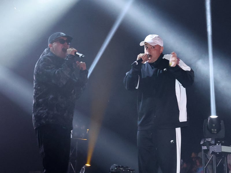 Mo Chara (L) and Moglai Bap from Irish Hip Hop trio Kneecap perform onstage during the 2025 Coachella Valley Music and Arts Festival at Empire Polo Club on April 11, 2025 in Indio, California.