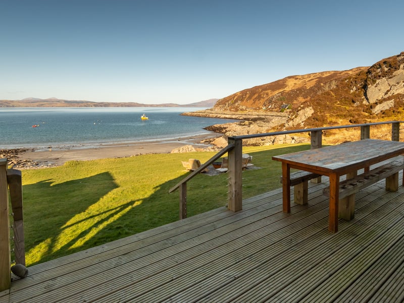With views over the Sound of Sleat to the Isle of Skye and the Cuillin mountain range, Doune Bay Lodge demands some serious down time on the deck.