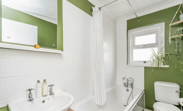 The listing says: "A 2 double bedroom mid terraced house having been improved by the present owners, situated in this popular residential road near to shopping facilities."